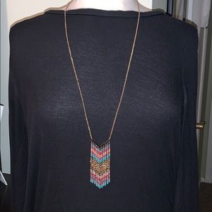 Gold toned long necklace